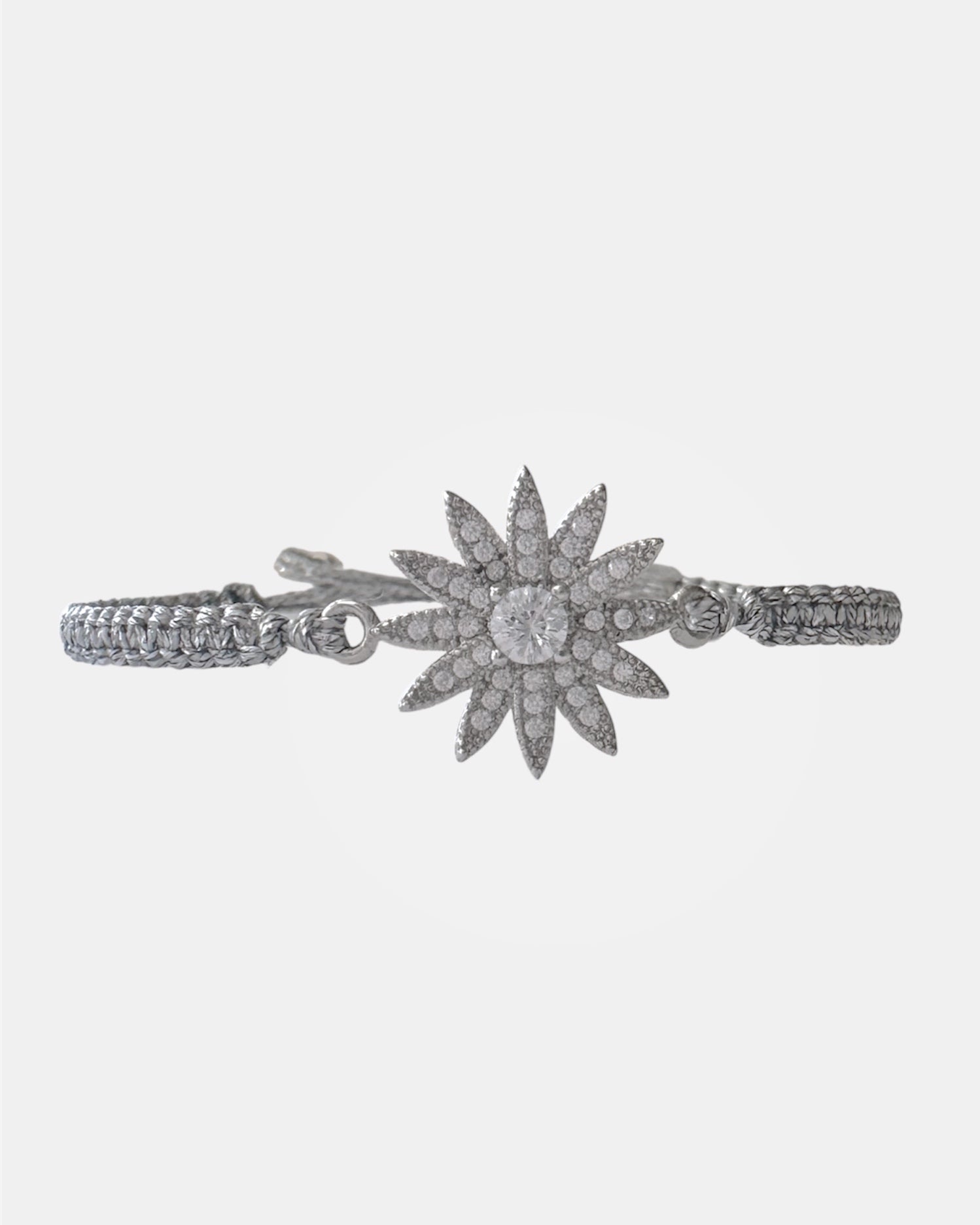 Silver macrame bracelet with zircon flower