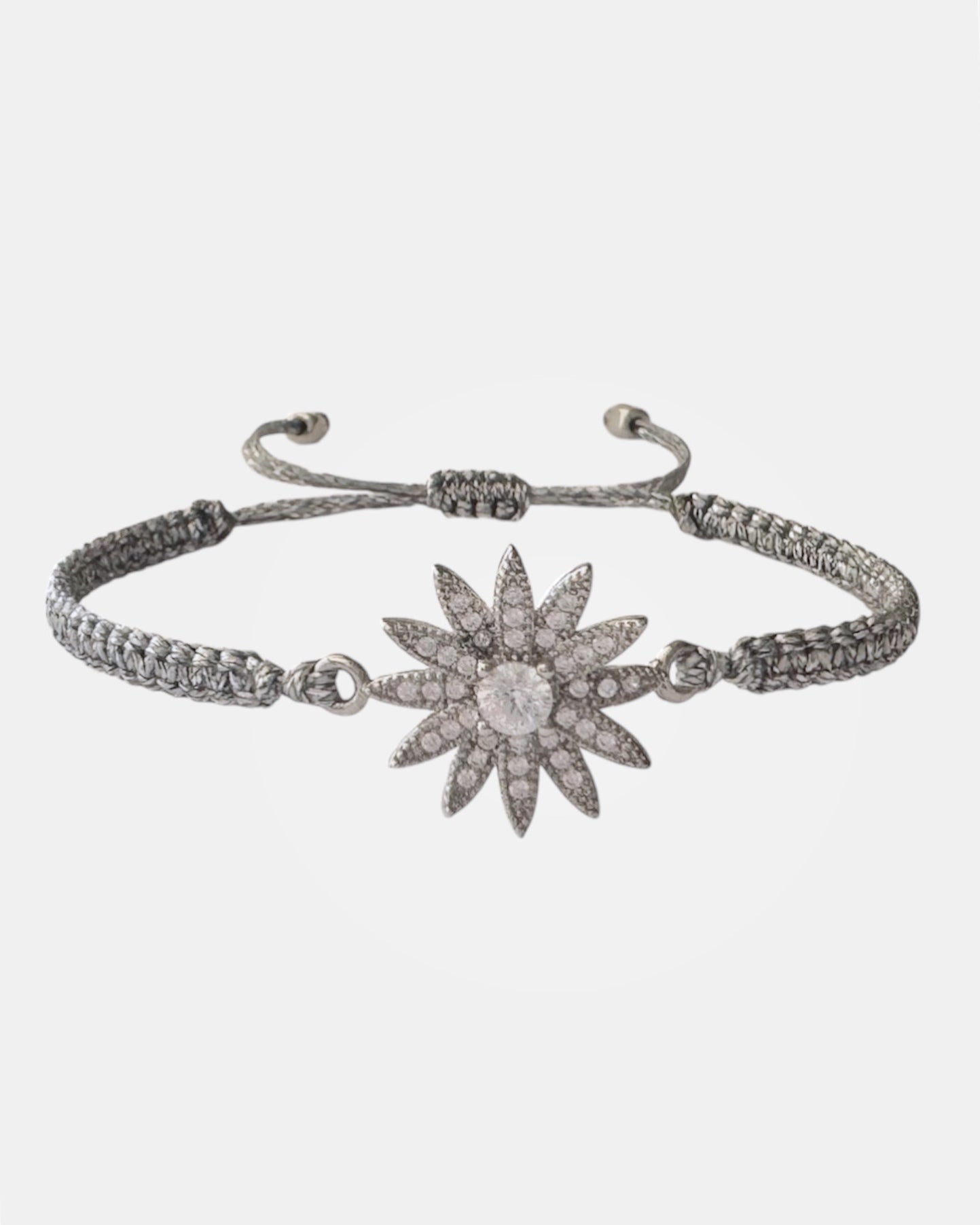Silver macrame bracelet with zircon flower