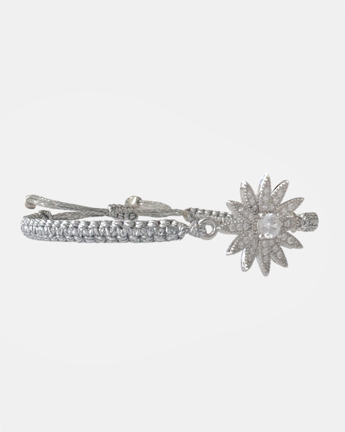 Silver macrame bracelet with zircon flower