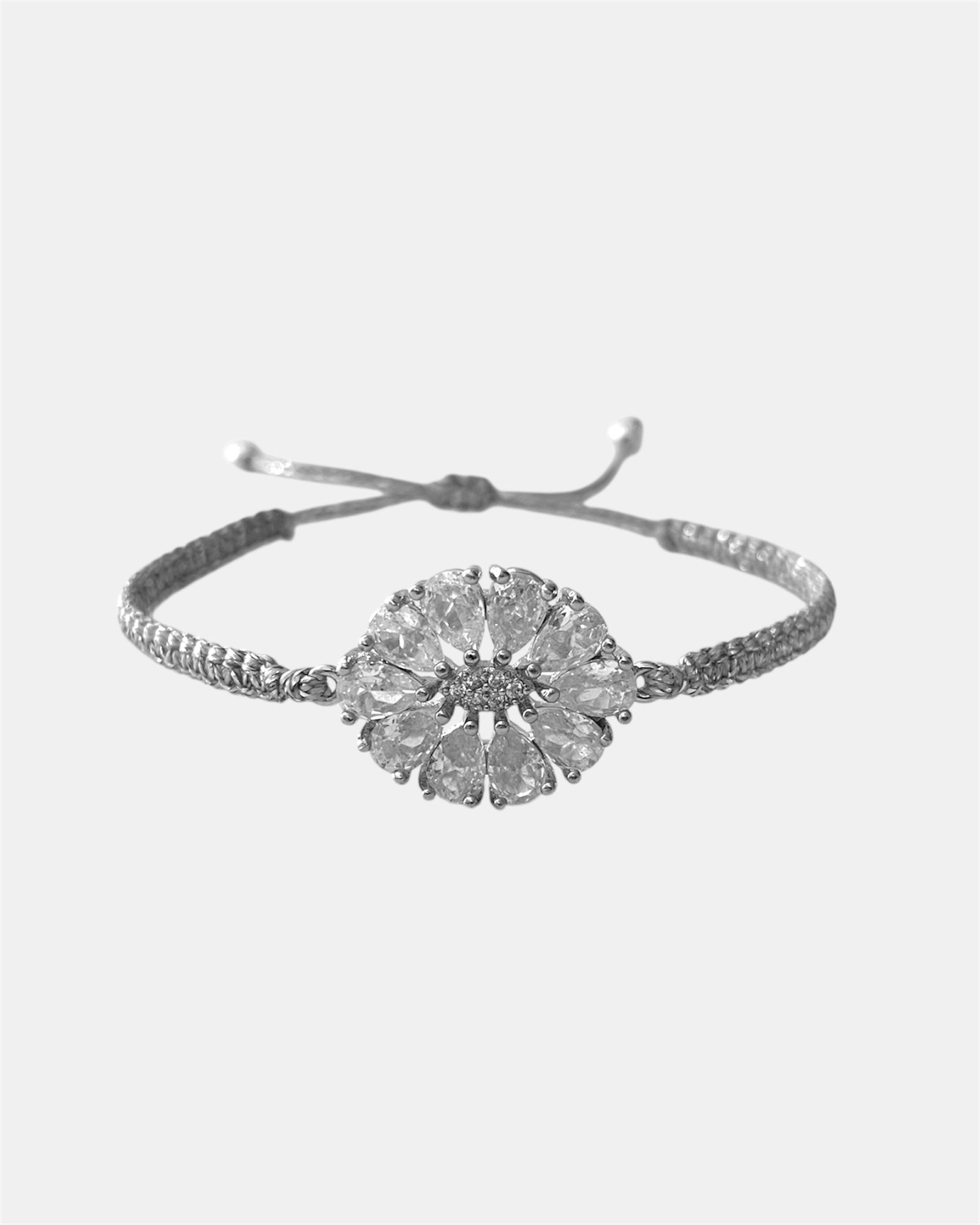 Silver macrame bracelet with zircon flower detail