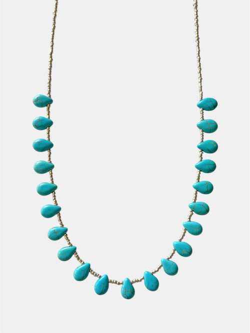 Turquoise necklace on a white background