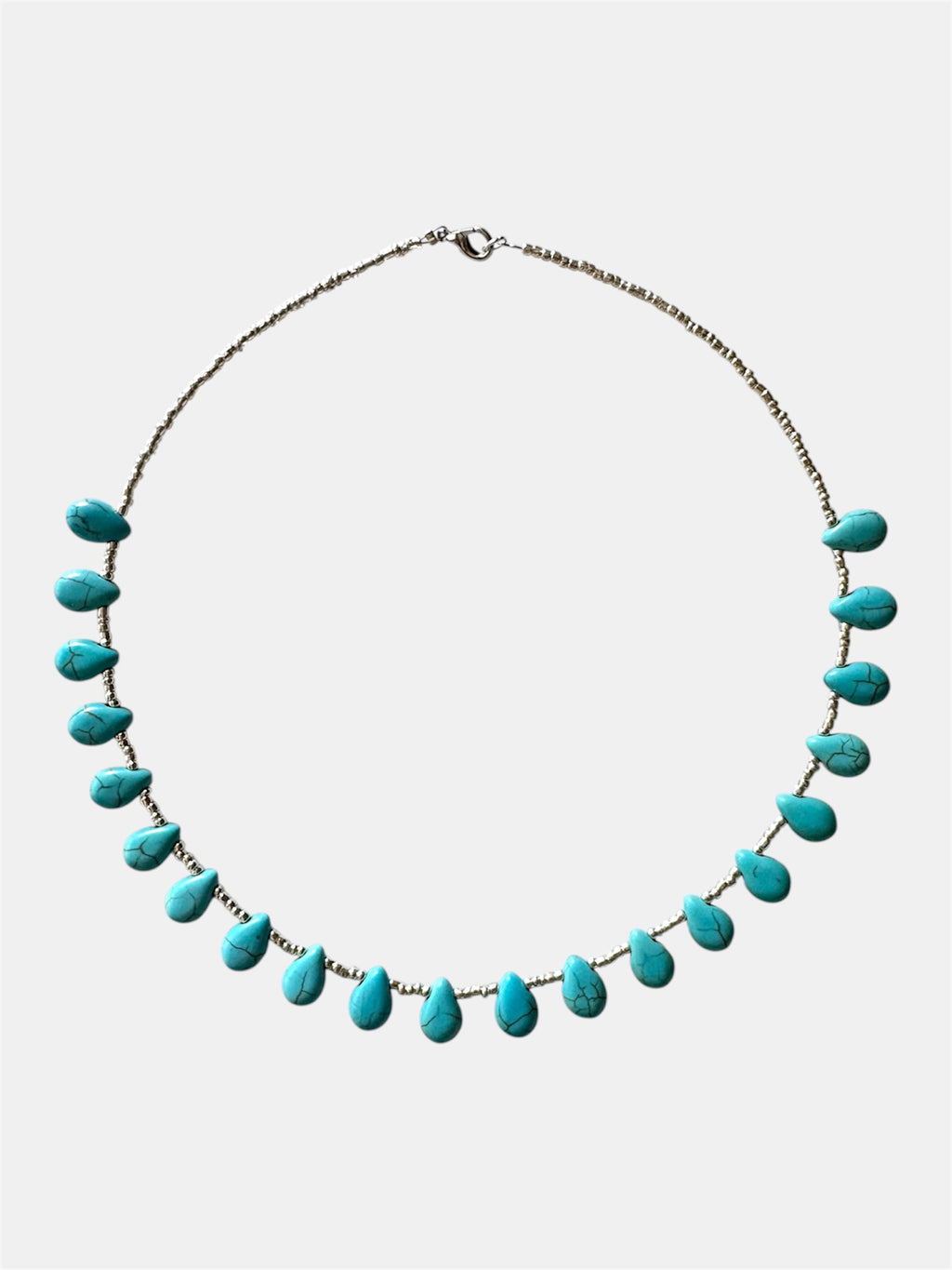 Turquoise necklace on a white background