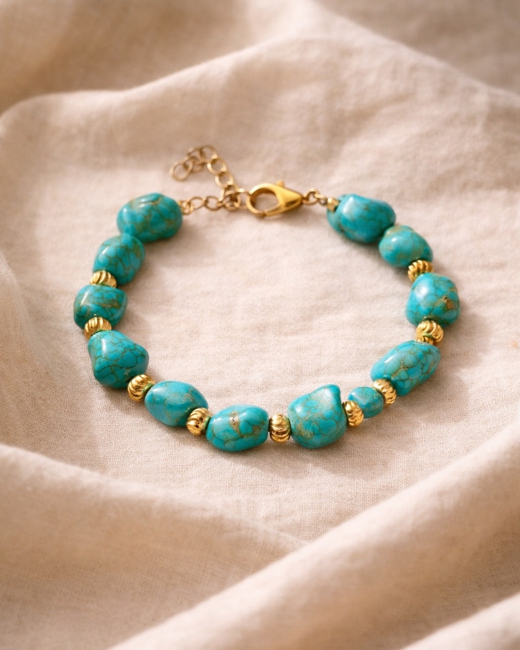 Turquoise bracelet featuring irregular-shaped stones and gold beads for a unique, bohemian style