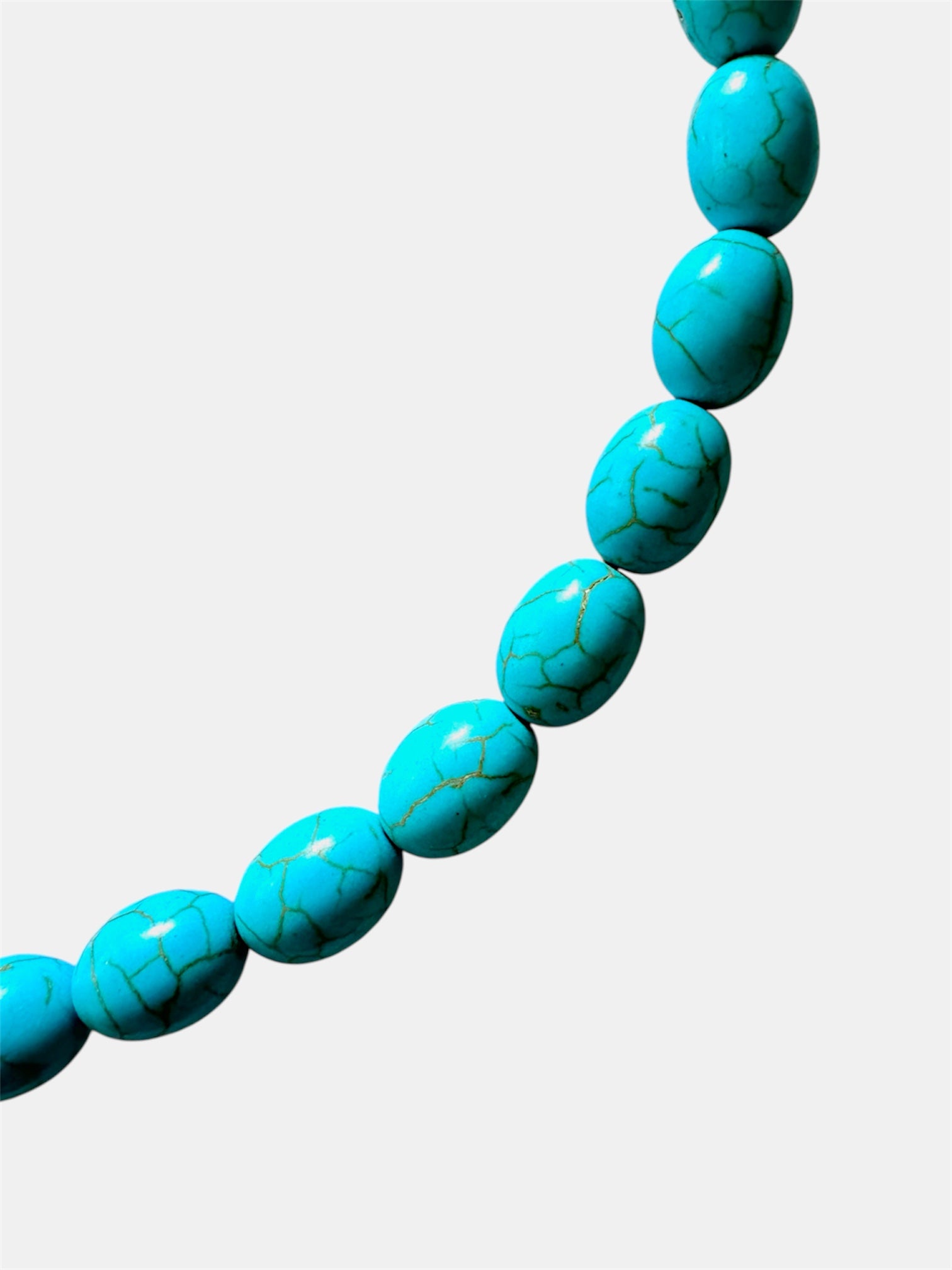 Turquoise necklace featuring a decorative fish charm for a playful and ocean-inspired accessory