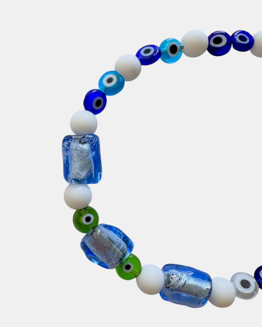 white bracelet with glass blue beads and evil eye charms, handmade jewelry piece for women and girls