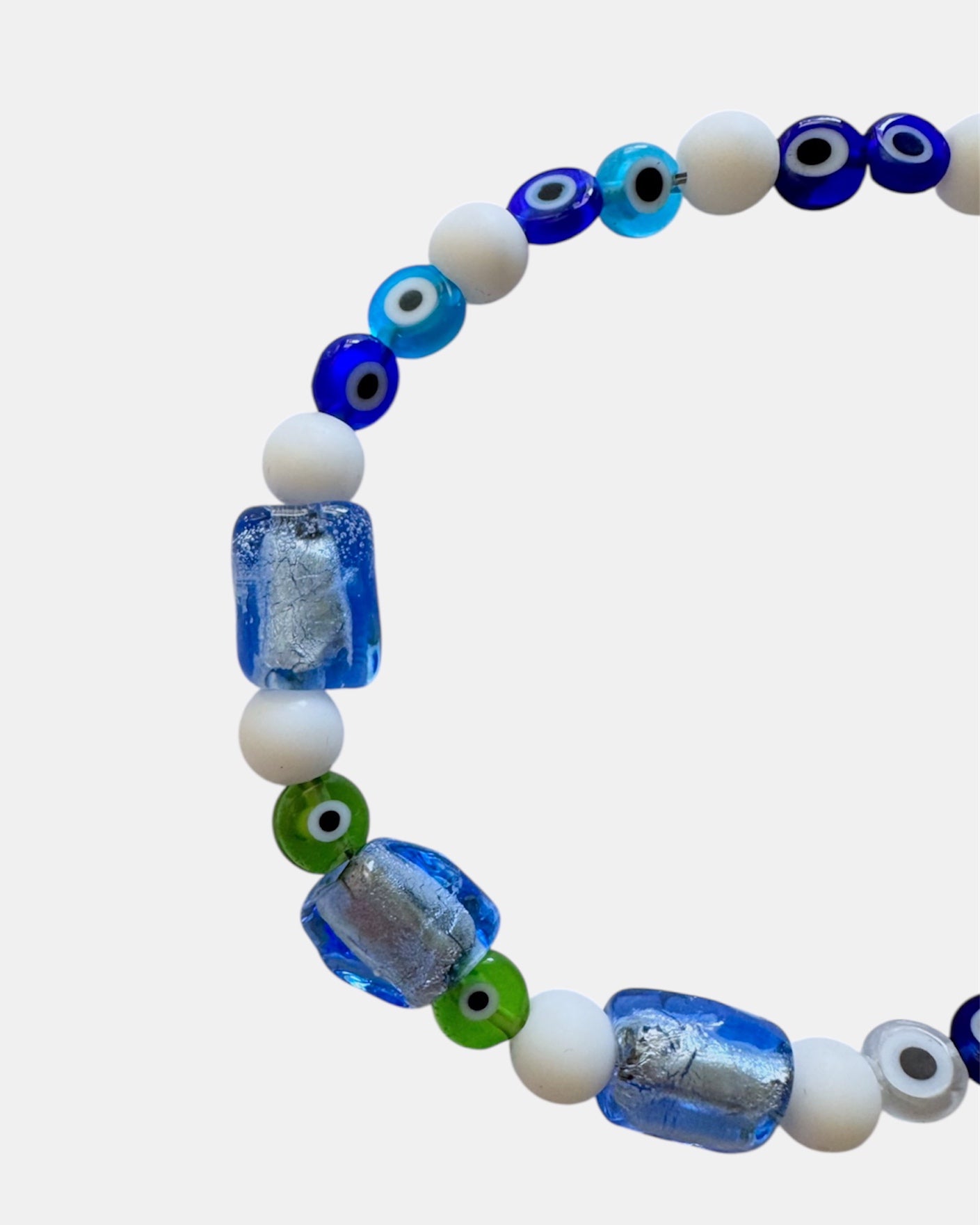 white bracelet with glass blue beads and evil eye charms, handmade jewelry piece for women and girls