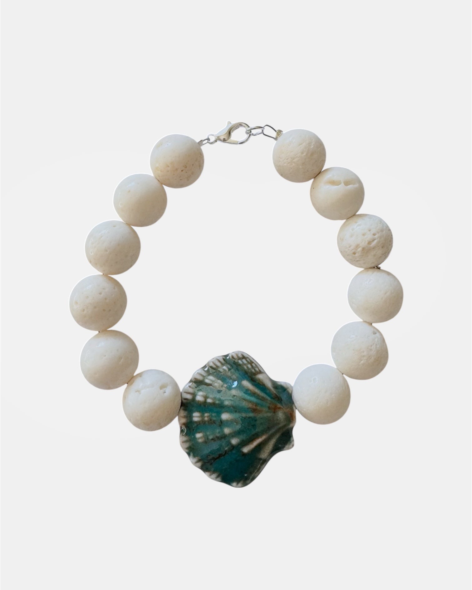 White bracelet with lava stone and ceramic shell