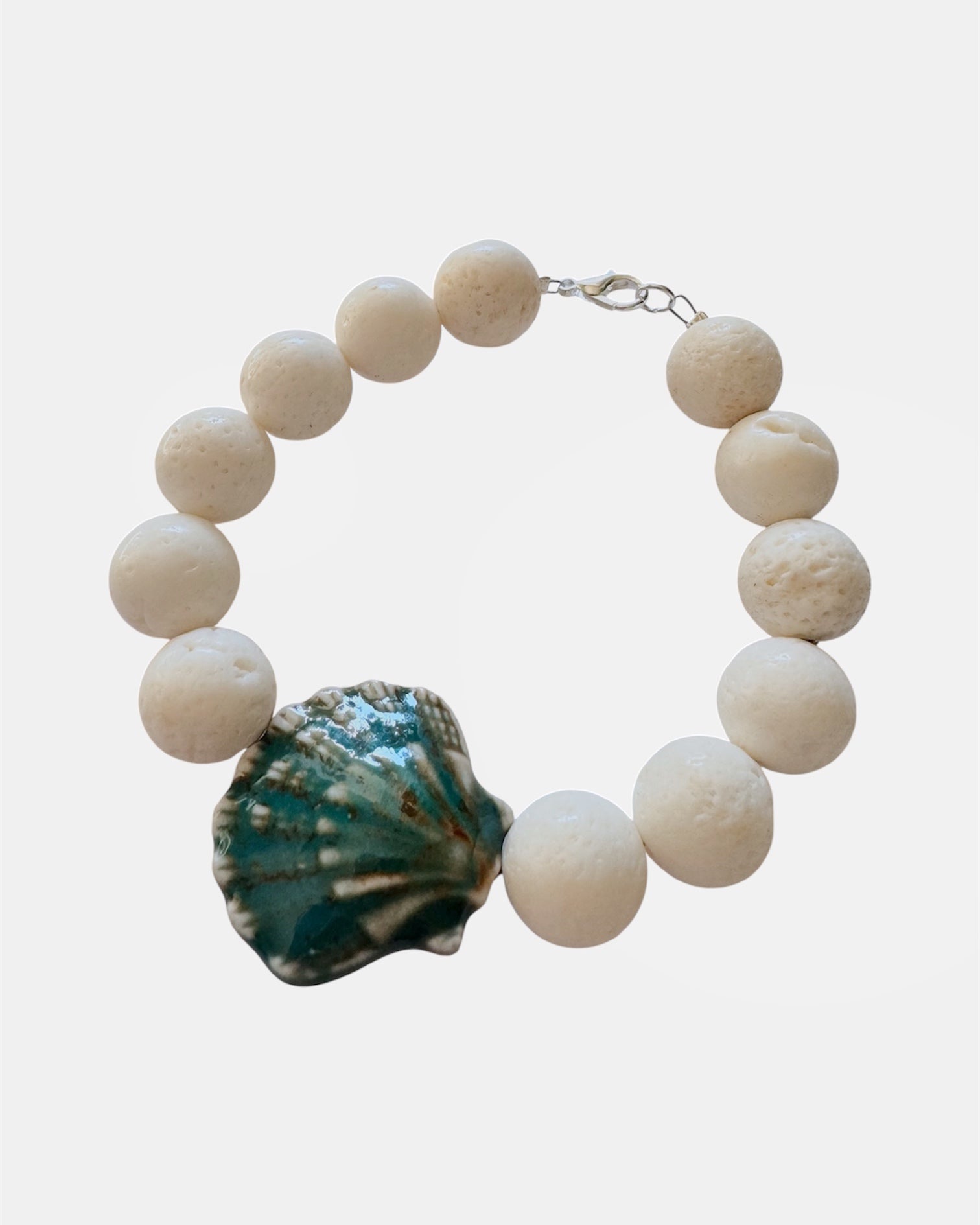 White bracelet with lava stone and ceramic shell