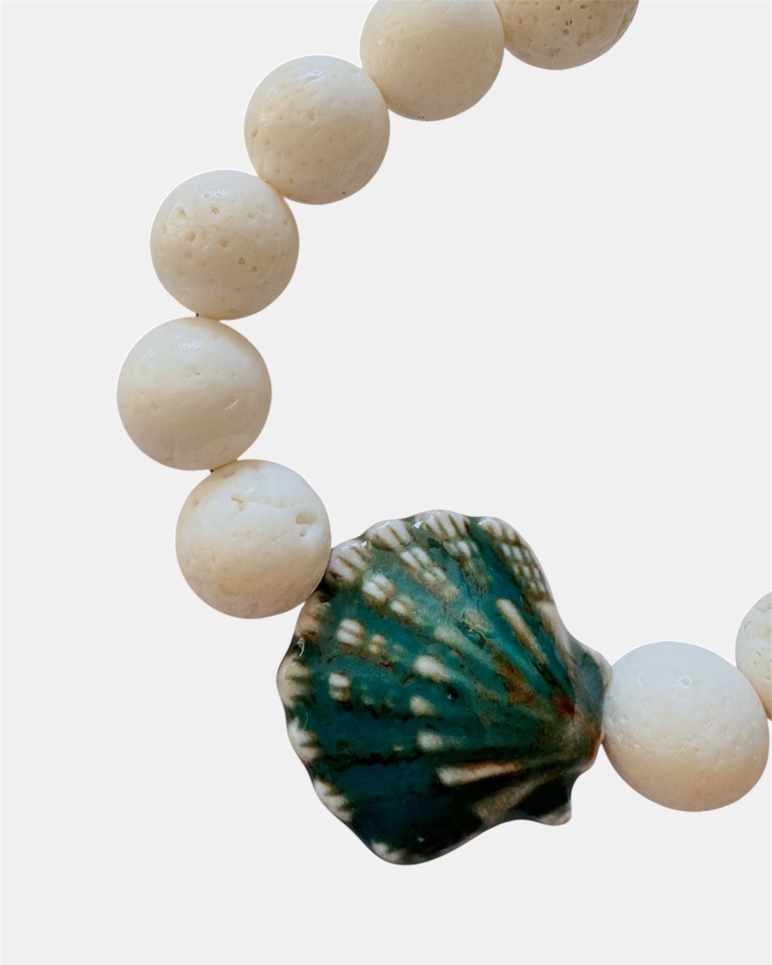 White bracelet with lava stone and ceramic shell
