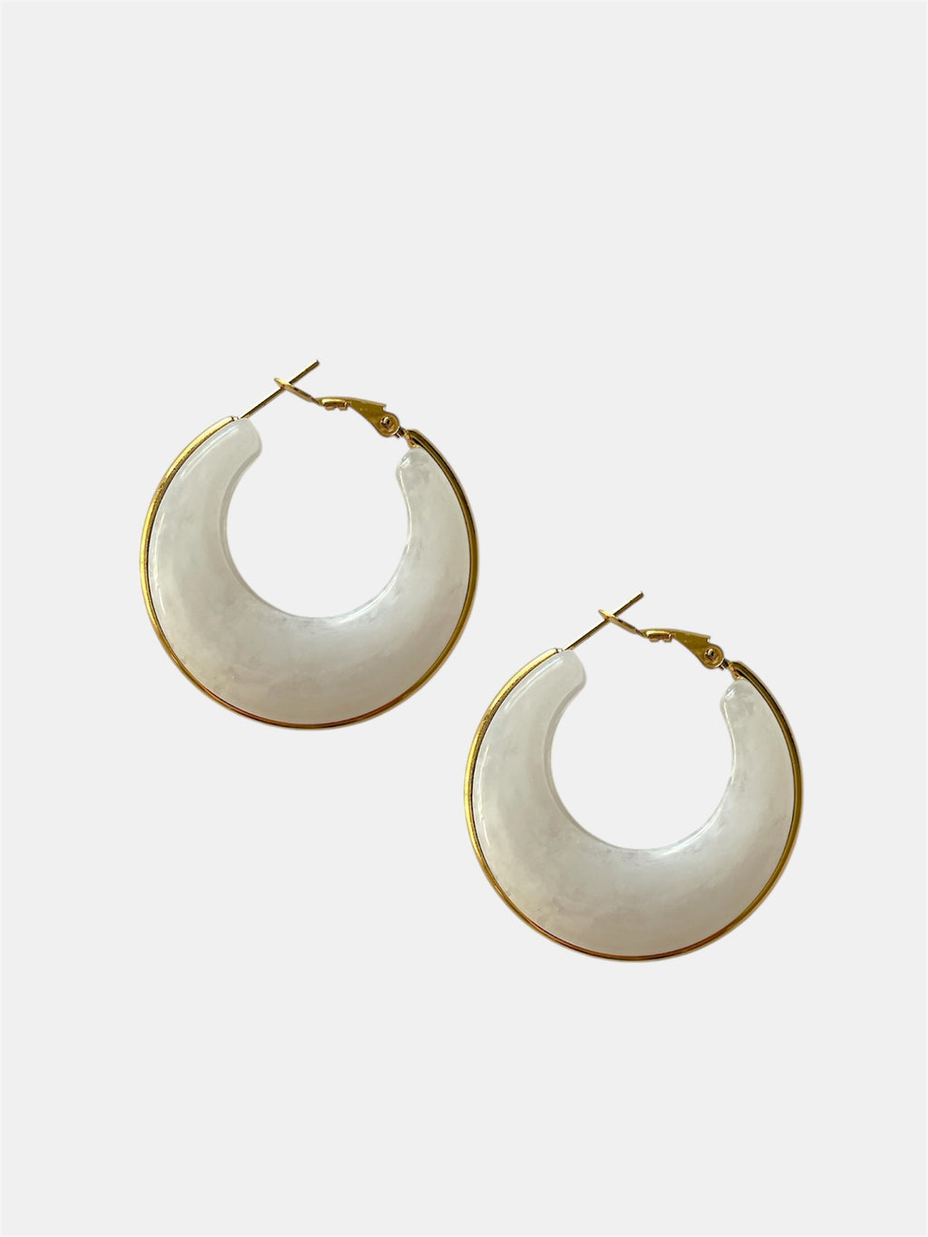 White hoop earrings with gold accents.
