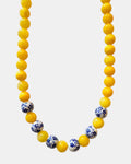 Yellow beaded necklace featuring ceramic accents for a cheerful and stylish look